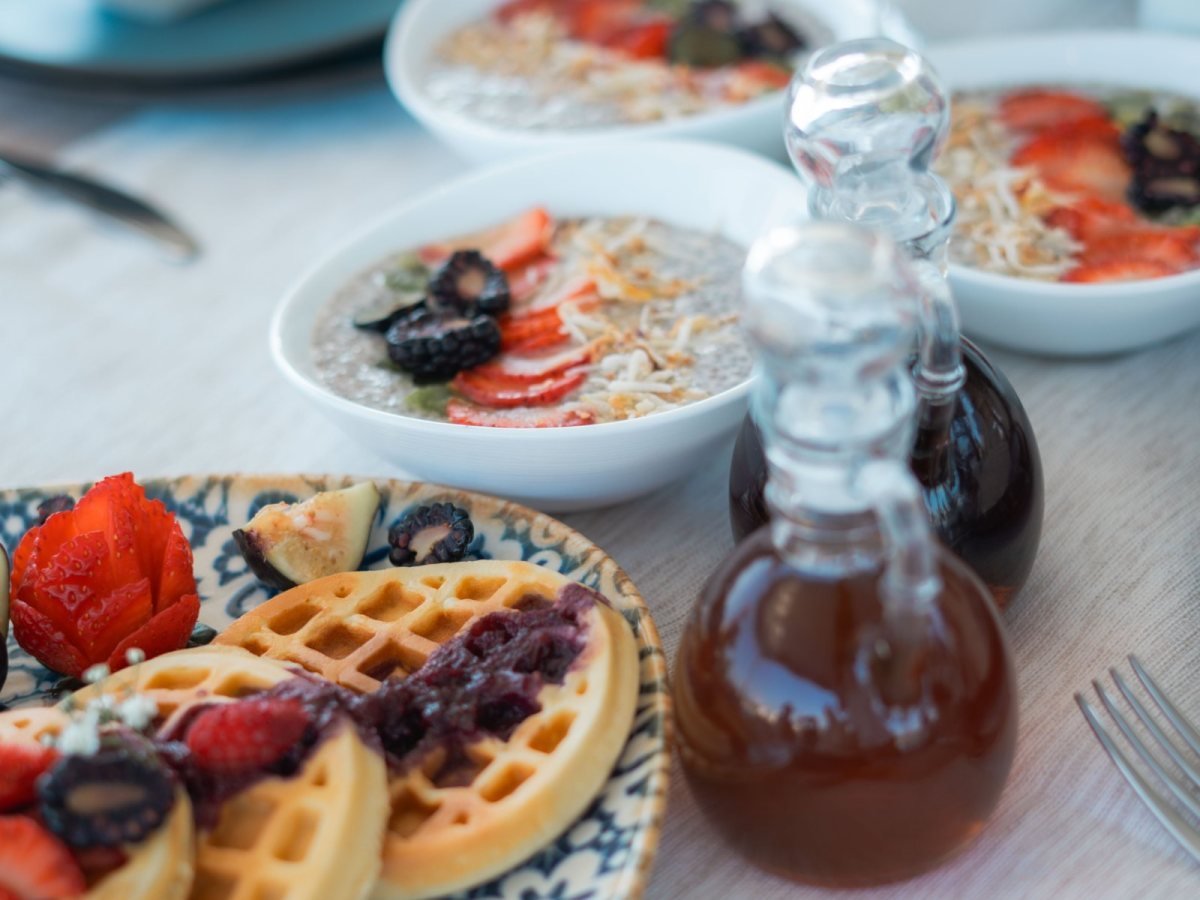 Breakfast of waffles, fruit and chia bowls served aboard a private yacht charter in Riviera Nayarit